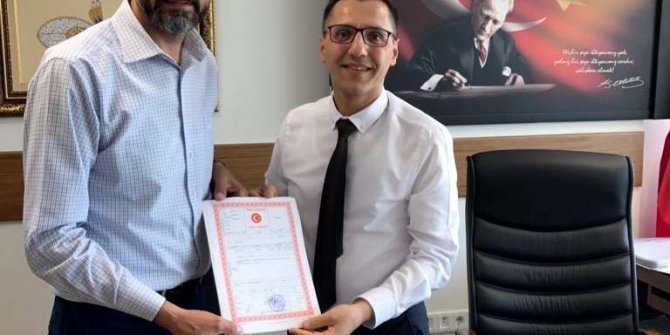 Doğanay, yeni il başkanlığı binasının tapusunu aldı