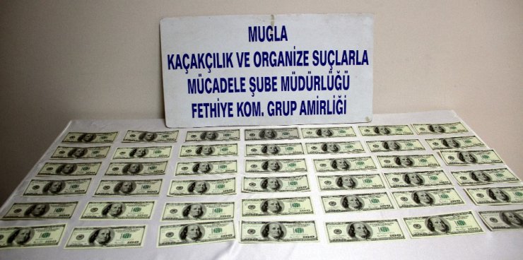 Fethiye’de piyasaya sahte dolar sürmeye çalışan 3 kişi tutuklandı